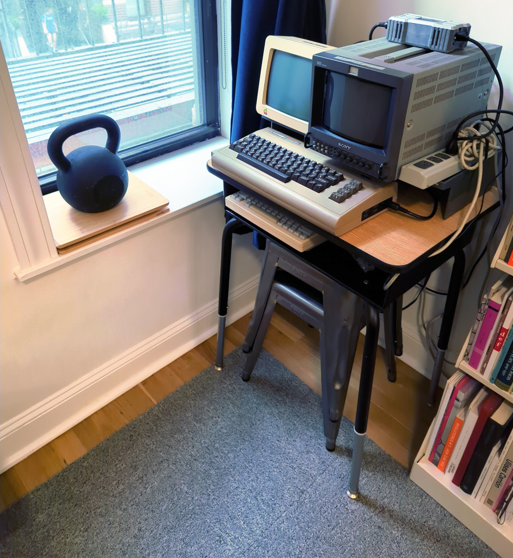 The NYC Trope Tank at Montfort and Klink’s apartment, with a VIC-20, an Ultimate 64, an Apple //c, and a contemporary Intel computer running Linux.